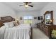 Bedroom with view of the lake and golf course at 29432 Coharie Loop, San Antonio, FL 33576