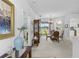 Elegant dining room featuring classic furniture, a large mirror, and seamless transitions to dining spaces at 29432 Coharie Loop, San Antonio, FL 33576