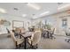 Bright game room featuring tables, chairs, and outside view for a comfortable community gaming experience at 29432 Coharie Loop, San Antonio, FL 33576