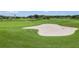 Golf course with lush green fairway and pristine sand trap for a challenging play at 29432 Coharie Loop, San Antonio, FL 33576