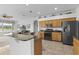 Spacious kitchen with stainless steel appliances, granite counters, and a breakfast bar at 29432 Coharie Loop, San Antonio, FL 33576