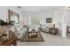 Bright living room with neutral tones, plantation shutters, and classic furniture at 29432 Coharie Loop, San Antonio, FL 33576