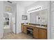Bright bathroom with dual sinks and ceramic tile floors at 29432 Coharie Loop, San Antonio, FL 33576