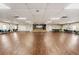 This large meeting room features hardwood floors, stage, and plenty of space for activities at 29432 Coharie Loop, San Antonio, FL 33576