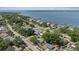 Aerial view of the property with a glimpse of the waterfront community and nearby docks at 324 Country Club Dr, Oldsmar, FL 34677