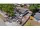 Elevated aerial view of the home, showing its yard, roof, and surrounding street and landscaping at 324 Country Club Dr, Oldsmar, FL 34677