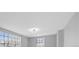 Bright bedroom with large windows and a modern ceiling light, offering a comfortable living space at 324 Country Club Dr, Oldsmar, FL 34677
