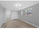 Bedroom featuring new ceiling fan light and double closet with a window view at 324 Country Club Dr, Oldsmar, FL 34677