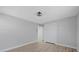 Bright bedroom features wood flooring, closet, and a neutral color scheme at 324 Country Club Dr, Oldsmar, FL 34677