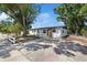 Beautifully renovated single-story home with a freshly painted exterior and manicured landscaping at 324 Country Club Dr, Oldsmar, FL 34677