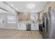 Kitchen featuring stainless steel appliances, ample cabinet space, and eat-in area by the front door at 324 Country Club Dr, Oldsmar, FL 34677