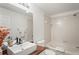 Modern bathroom featuring a vessel sink, decorative mirror, and tub with shower at 3437 Dragon View Ct, Valrico, FL 33594