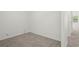 Cozy bedroom featuring neutral carpet, white walls, and a window at 3437 Dragon View Ct, Valrico, FL 33594