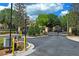 Gated community entrance with lush landscaping and secure access at 3437 Dragon View Ct, Valrico, FL 33594