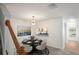 Bright dining area with a modern chandelier and convenient kitchen pass-through at 3437 Dragon View Ct, Valrico, FL 33594