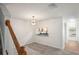Bright dining area with a modern chandelier and convenient kitchen pass-through at 3437 Dragon View Ct, Valrico, FL 33594