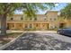 Charming townhome featuring a colorful exterior and well-maintained landscaping with convenient parking spaces at 3437 Dragon View Ct, Valrico, FL 33594