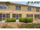 Townhouse exterior with a well-manicured lawn and screened back porches at 3437 Dragon View Ct, Valrico, FL 33594