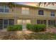 Townhouse exterior with a well-manicured lawn and screened back porches at sunset at 3437 Dragon View Ct, Valrico, FL 33594