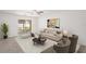 A large living room with sliding glass doors to screened in patio at 3437 Dragon View Ct, Valrico, FL 33594