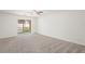 A large living room with sliding glass doors to screened in patio at 3437 Dragon View Ct, Valrico, FL 33594