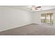 A large living room with sliding glass doors to screened in patio at 3437 Dragon View Ct, Valrico, FL 33594
