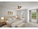 A main bedroom suite with decorative ceiling fan and neutral décor at 3437 Dragon View Ct, Valrico, FL 33594