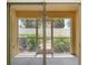 Enclosed screen porch featuring sliding glass doors and a view of the backyard at 3437 Dragon View Ct, Valrico, FL 33594