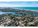 Stunning aerial view showcasing the home's proximity to the beach and waterfront community at 3962 Poinsettia Dr, St Pete Beach, FL 33706