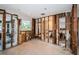 Bedroom undergoing renovations with exposed walls revealing the framework and a bathroom under construction at 3962 Poinsettia Dr, St Pete Beach, FL 33706