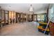 Open-concept living space undergoing renovations, showcasing original flooring and framework at 3962 Poinsettia Dr, St Pete Beach, FL 33706