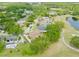 Aerial view of a neighborhood, golf course, and lake at 4033 Priory Cir, Tampa, FL 33618