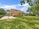View of the home's backyard featuring a basketball hoop at 4033 Priory Cir, Tampa, FL 33618