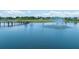 Picturesque community lake featuring a fountain, and boardwalk creating a serene and inviting outdoor space at 4033 Priory Cir, Tampa, FL 33618