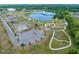 Aerial view of the community park, showcasing a lake with fountain, walking paths, and ample parking at 4033 Priory Cir, Tampa, FL 33618