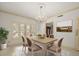 Dining room features chandelier, table with chairs and shutters at 4033 Priory Cir, Tampa, FL 33618