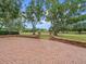 Long brick driveway leading to the backyard, lawn, and golf course at 4033 Priory Cir, Tampa, FL 33618
