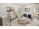 Bright living room with neutral tones, plush furniture, decorative artwork, and a patterned rug at 4033 Priory Cir, Tampa, FL 33618