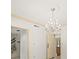 Living room featuring a chandelier with adjacent doors and shutters at 4033 Priory Cir, Tampa, FL 33618