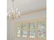 Living room features a chandelier and shutters at 4033 Priory Cir, Tampa, FL 33618