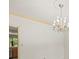 Living room boasts a chandelier with adjacent doors and shutters at 4033 Priory Cir, Tampa, FL 33618
