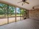 Covered brick patio with serene views of the lawn and golf course at 4033 Priory Cir, Tampa, FL 33618