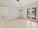 Bright dining area features tiled floor and french doors to the outside at 4033 Priory Cir, Tampa, FL 33618