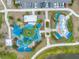 Aerial view of a community splash pad and playground featuring engaging water features and play structures at 4033 Priory Cir, Tampa, FL 33618