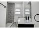 Bathroom featuring a modern shower, toilet, and vanity with a sink and mirror at 4519 5Th S Ave, St Petersburg, FL 33711
