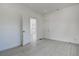 Open bedroom with an open doorway leading to another room at 4519 5Th S Ave, St Petersburg, FL 33711
