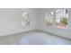 Bright bedroom featuring large windows and modern gray tile flooring at 4519 5Th S Ave, St Petersburg, FL 33711