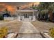 Charming home with classic architecture, featuring a welcoming front porch and landscaped walkway at 4519 5Th S Ave, St Petersburg, FL 33711