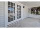 Close-up of front porch with double doors and stylish outdoor lighting at 4519 5Th S Ave, St Petersburg, FL 33711