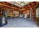 Spacious garage interior with an open ceiling, tools, and storage at 4519 5Th S Ave, St Petersburg, FL 33711